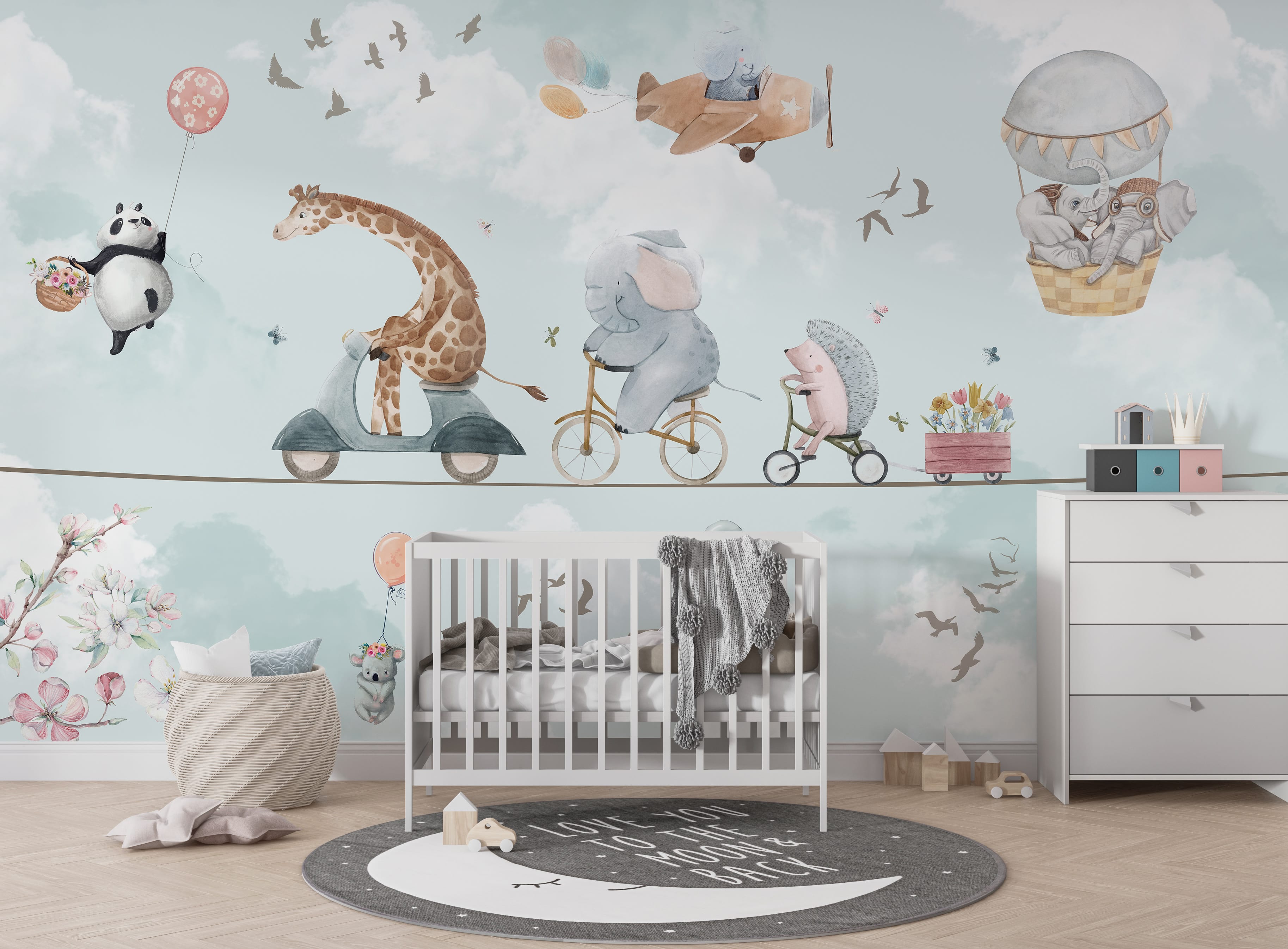 Safari nursery mural with a giraffe riding a scooter, elephant on a bicycle, and hedgehog traveling on a tricycle