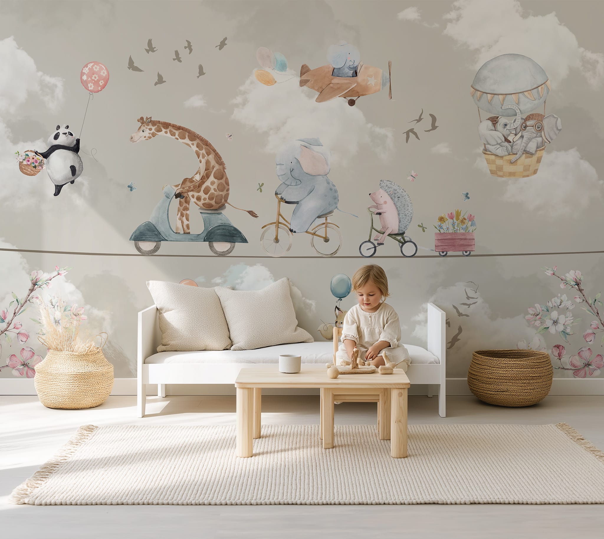 Safari nursery mural featuring a giraffe riding a scooter, elephant on a bicycle and hedgehog on a tricycle