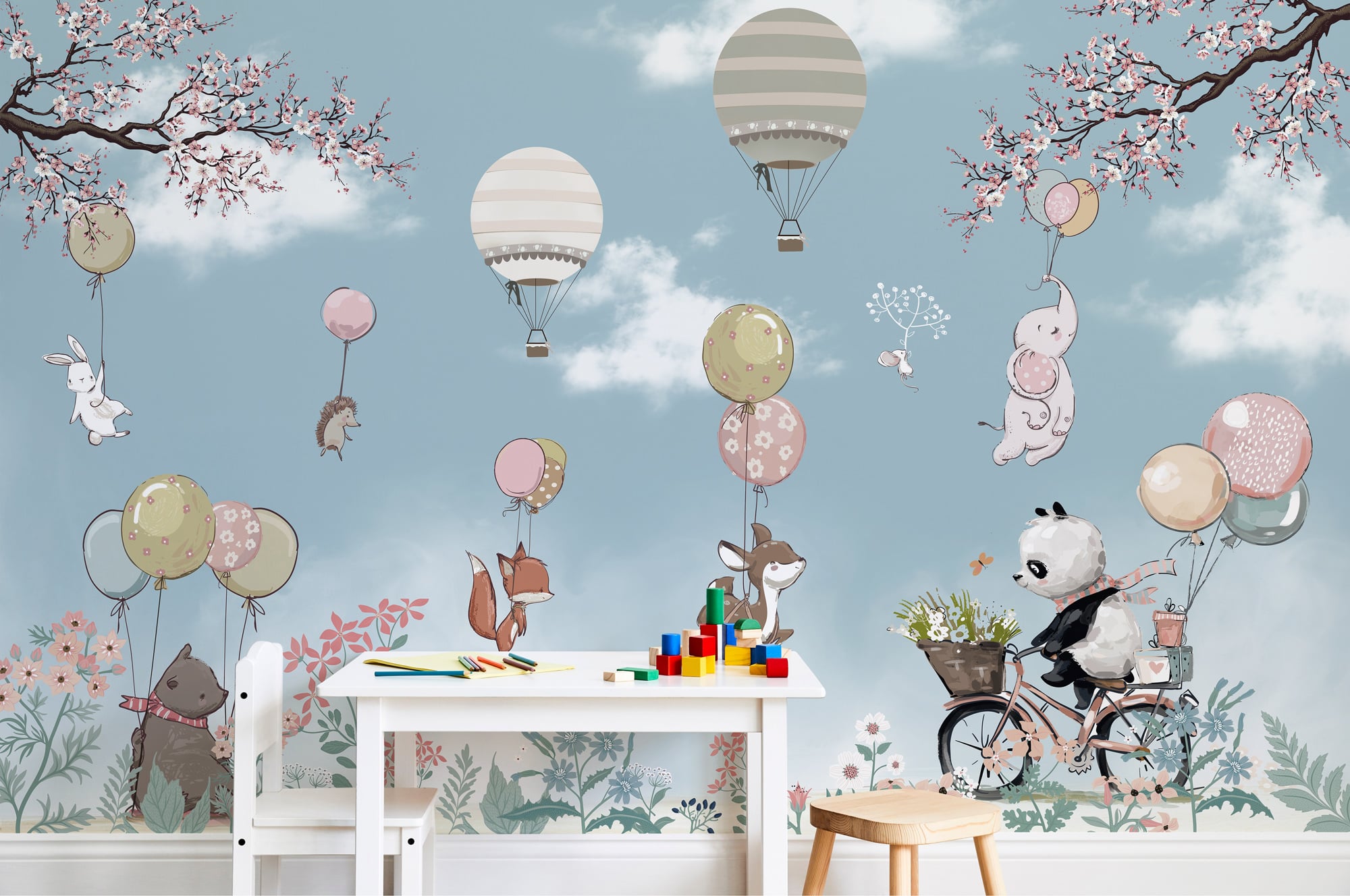Whimsical nursery mural featuring floating animals and hot air balloons